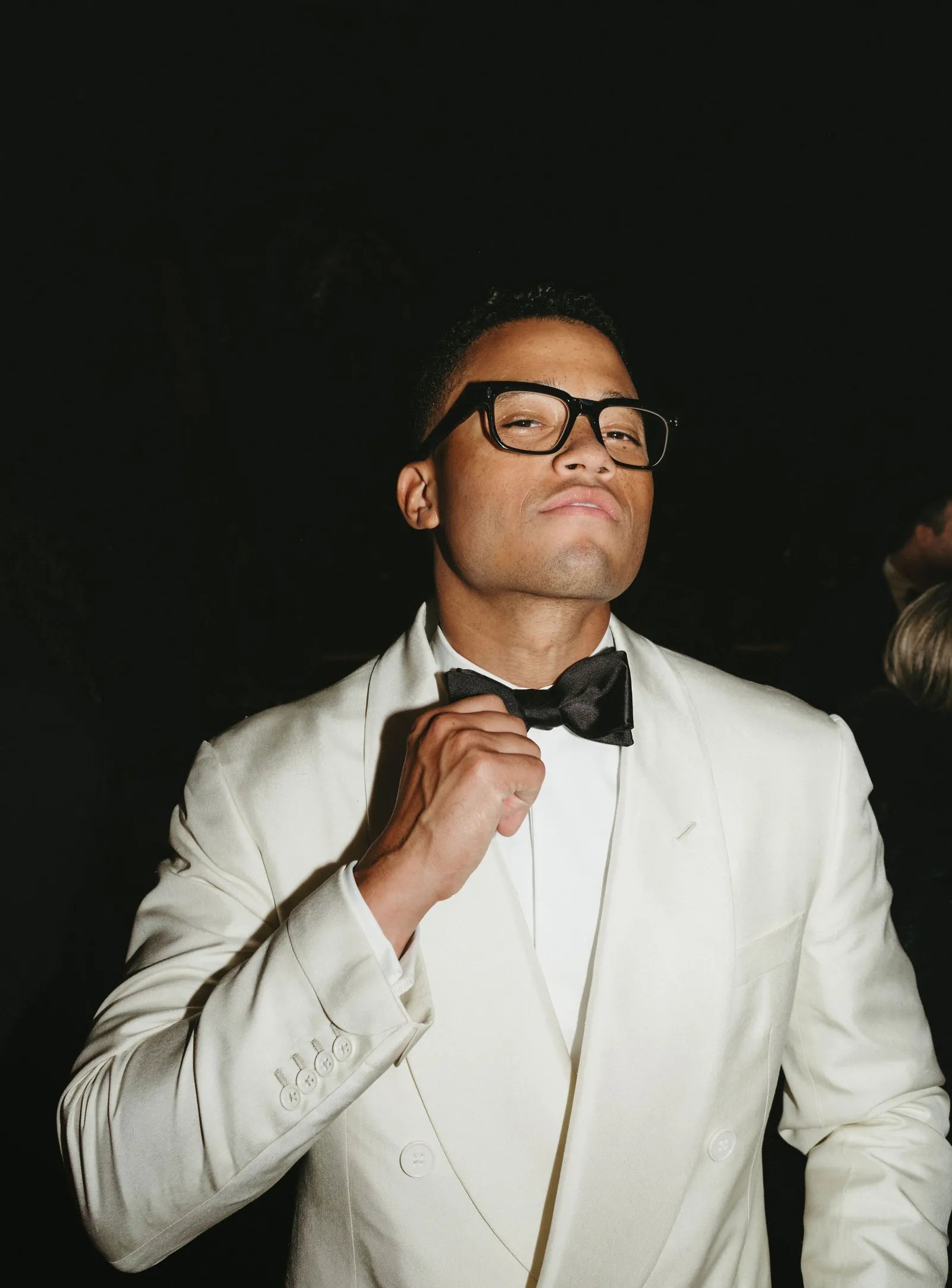 Image may contain Toby Love Clothing Formal Wear Suit Accessories Glasses Tie Shirt Blazer Coat Jacket and Tuxedo