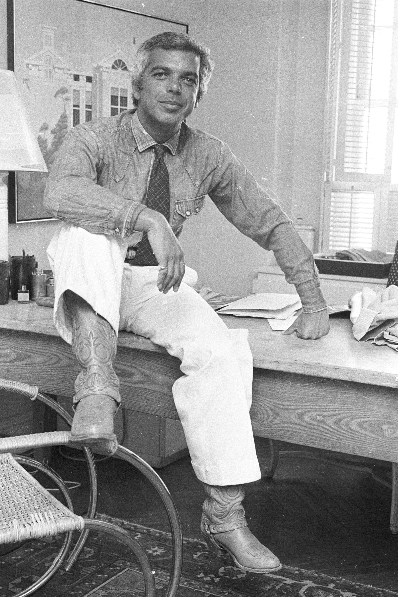 Image may contain Ralph Lauren Person Sitting Adult Clothing Footwear Shoe Face Head Photography and Portrait