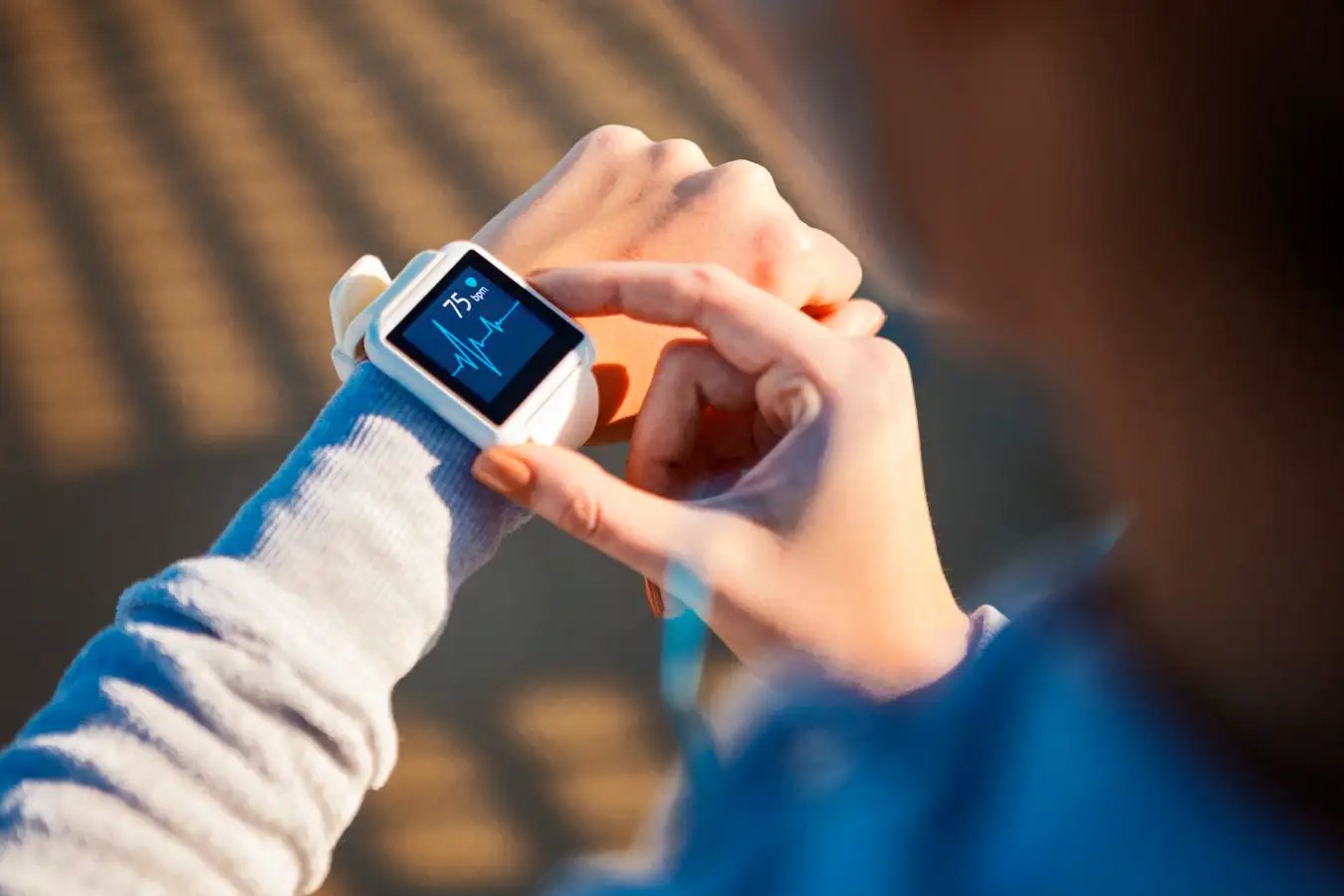 Someone reading their heart rate monitor.