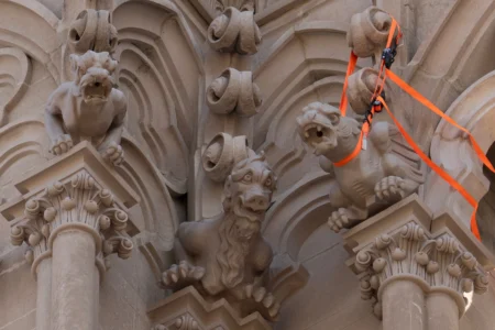 The final new terra cotta gargoyle is secured at right after being installed high on the Cathedral Basilica of the Assumption, known as "America's Notre Dame," in Covington, Ky., on Monday, March 30, 2026. (Credit: Carolyn Kaster/AP.)
