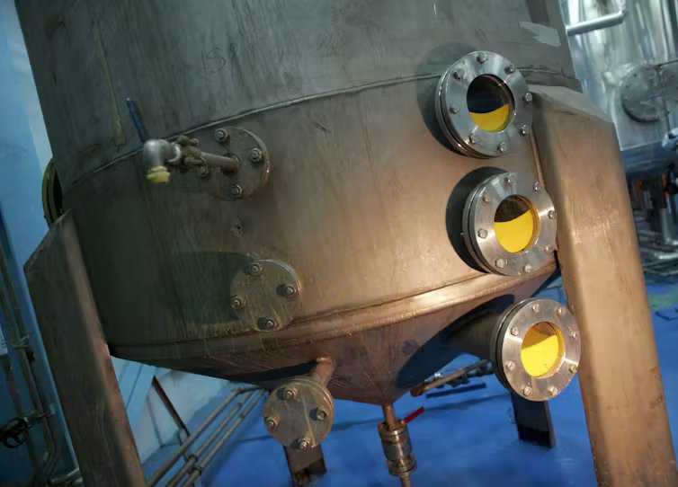 A machine produces a yellow substance.