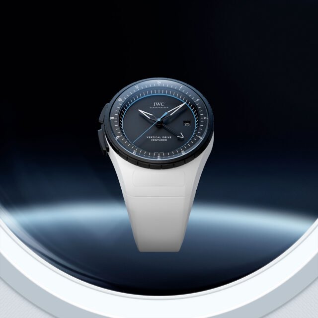 a black face and white strap on a wristwatch is seen floating above Earth in this rendering