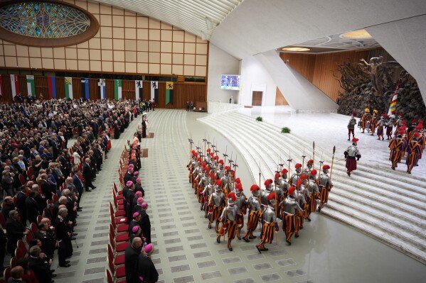 New Pontifical Swiss Guards attend a swearing-in ceremony in the Paul VI Hall at the Vatican, Wednesday, May 6, 2026. (AP Photo/Andrew Medichini)