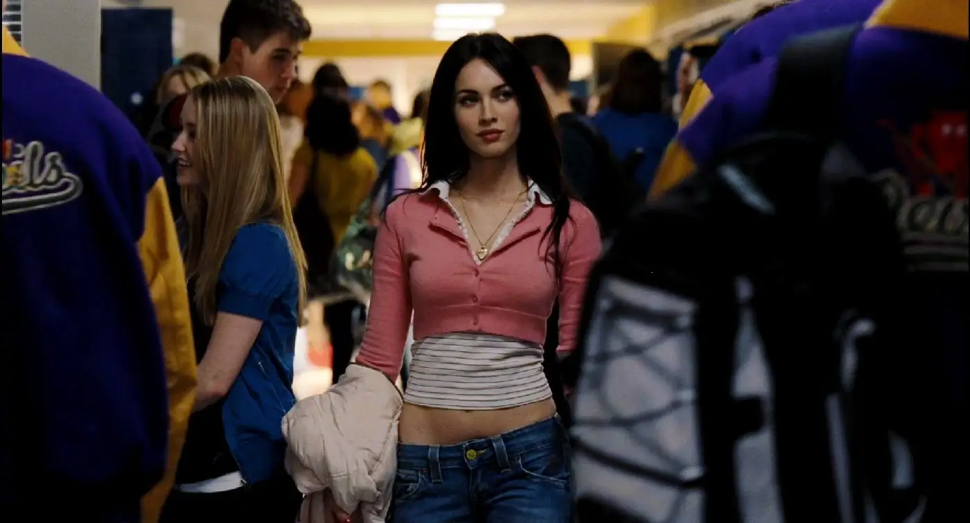 Megan Fox walking down a high school hallway