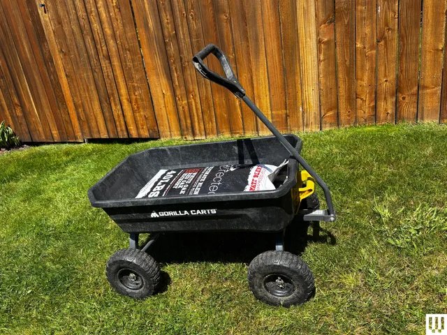 Image may contain: Grass, Plant, Transportation, Vehicle, Wagon, Machine, Wheel, Device, Lawn, Lawn Mower, Tool, and Carriage