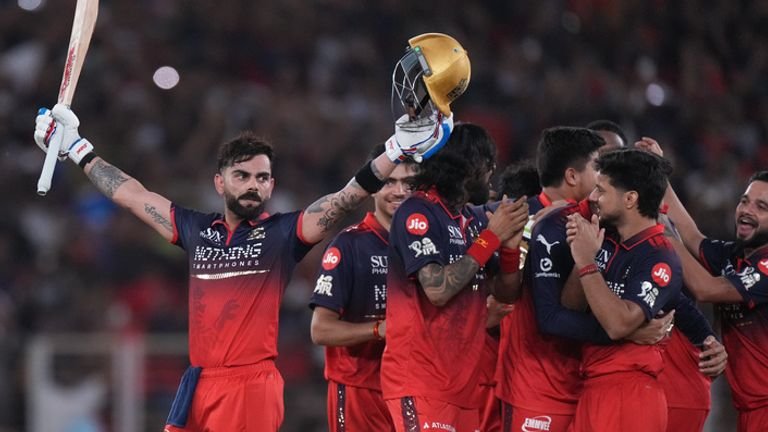 Royal Challengers Bengaluru's Virat Kohli celebrates with teammates after their win in the Indian Premier League final cricket match against Gujarat Titans in Ahmedabad, India, Sunday, May 31, 2026. (AP Photo/Ajit Solanki)