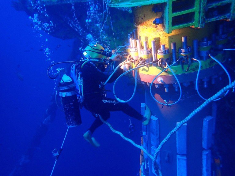 A scuba diver checks the underwater structure of the second phase of Deep Sea No. 1.