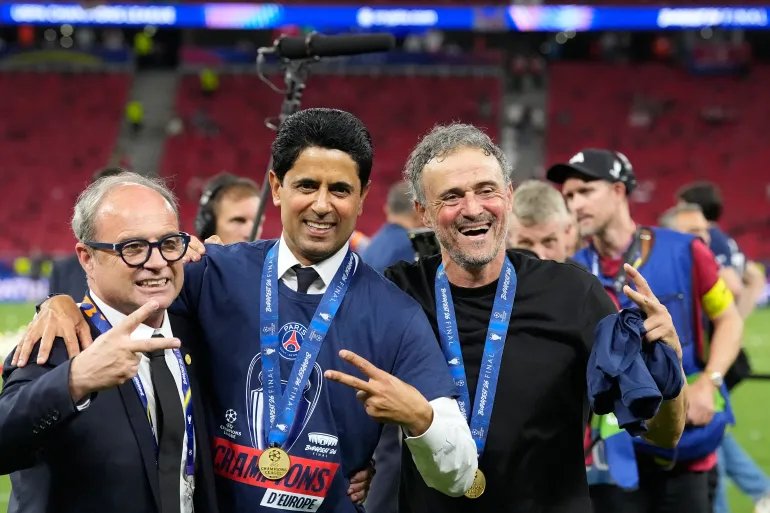 PSG's head coach Luis Enrique, from right, club President Nasser bin Ghanim Al-Khelaifi and sports director Luis Campos pose after winning the Champions League final soccer match between Paris Saint-Germain and Arsenal